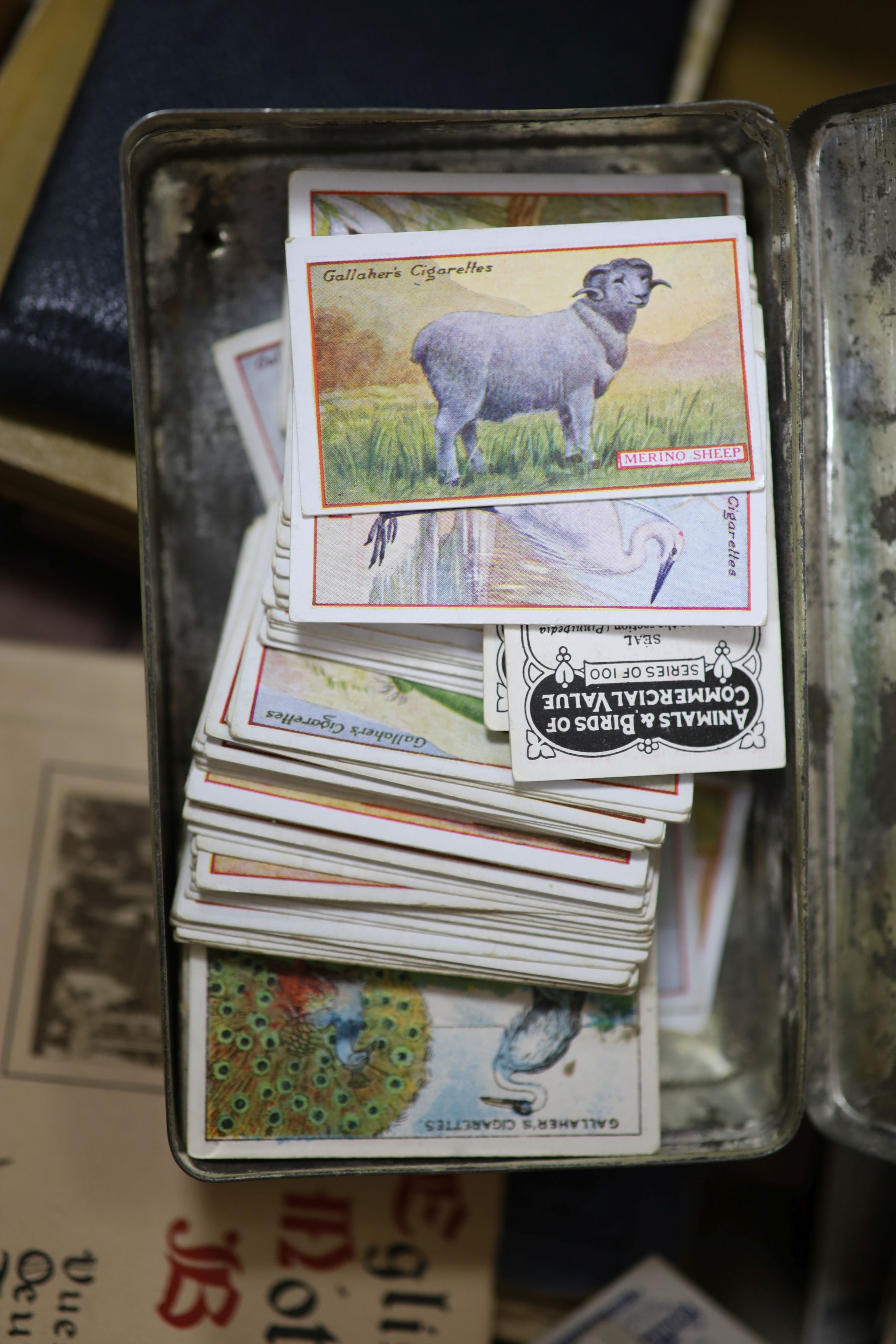 A collection of cigarette cards and ephemera